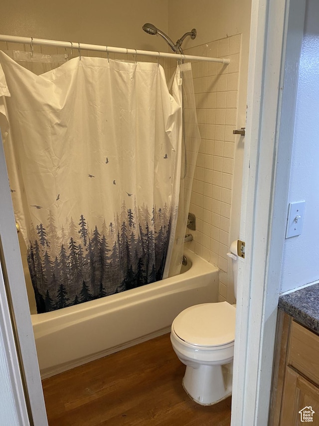 570 W Main St, Green River, UT 84525 - bathroom with vanity, shower / bathtub combination with curtain, toilet, and wood finished floors