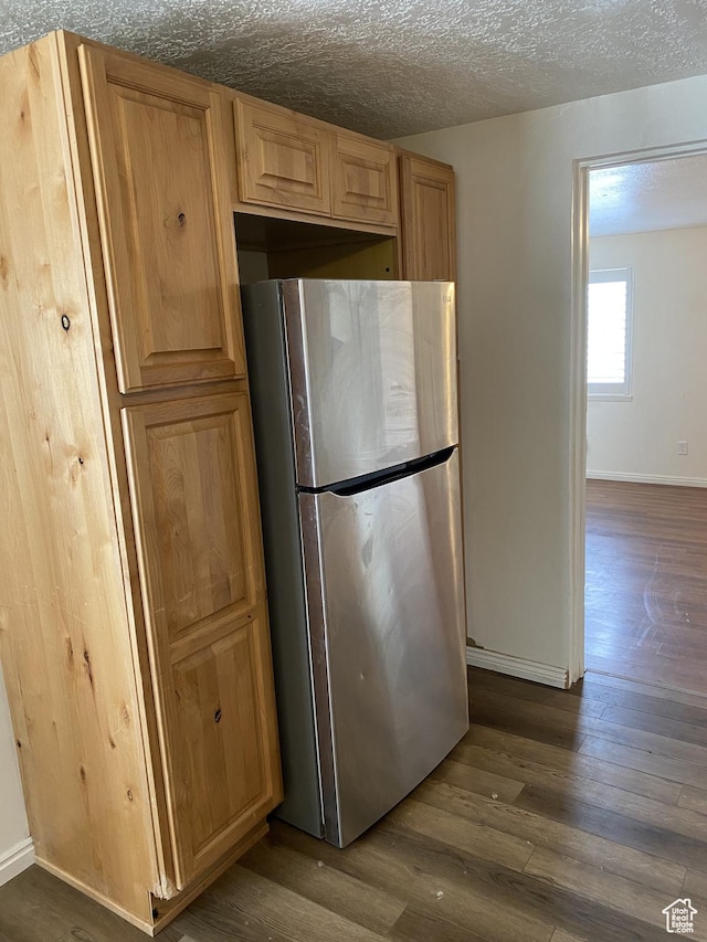 570 W Main St, Green River, UT 84525 - kitchen featuring baseboards, a textured ceiling, dark wood-style floors, and freestanding refrigerator