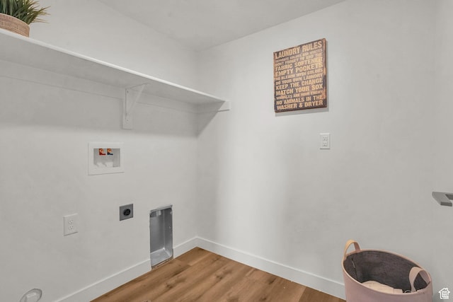 laundry room with washer hookup, wood finished floors, baseboards, hookup for an electric dryer, and laundry area