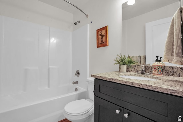 full bath with shower / bathtub combination, toilet, and vanity