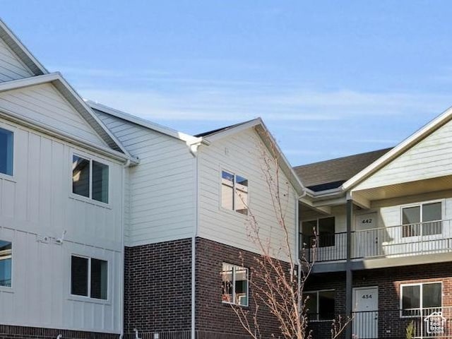 view of side of property with brick siding