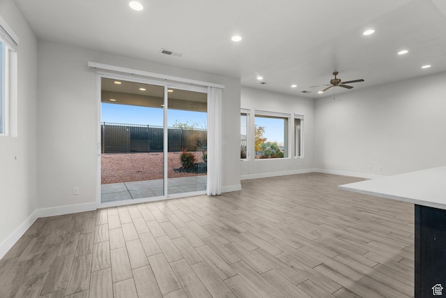 2128 N Montagna St, Washington, UT 84780 - unfurnished living room with a ceiling fan, visible vents, recessed lighting, wood finished floors, and baseboards