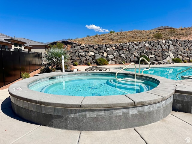 2128 N Montagna St, Washington, UT 84780 - view of pool featuring fence and an in ground hot tub
