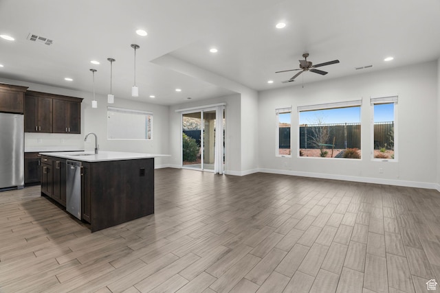 2128 N Montagna St, Washington, UT 84780 - kitchen with open floor plan, light countertops, visible vents, ceiling fan, and appliances with stainless steel finishes