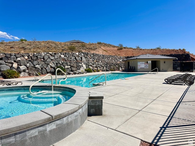 2128 N Montagna St, Washington, UT 84780 - community pool featuring a patio area and a hot tub