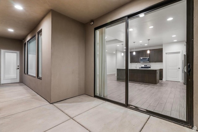 2128 N Montagna St, Washington, UT 84780 - doorway to property featuring a patio area