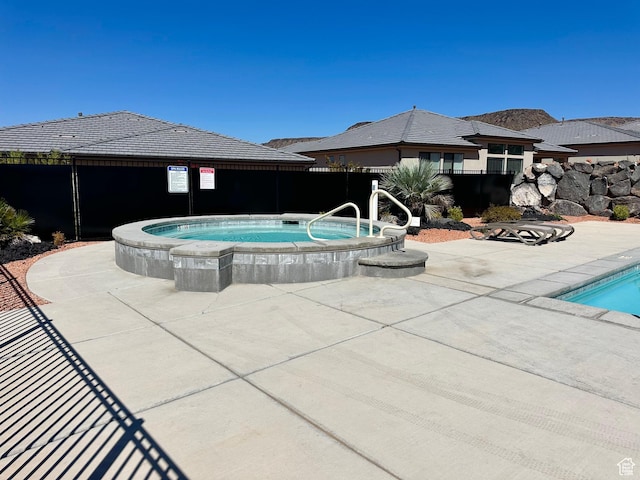 2128 N Montagna St, Washington, UT 84780 - view of swimming pool with fence and a community hot tub