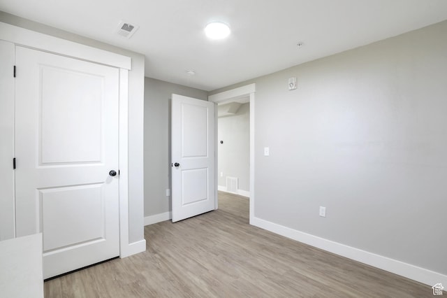 2745 Grant Ave, Ogden, UT 84401 - unfurnished bedroom with light wood finished floors, baseboards, and visible vents