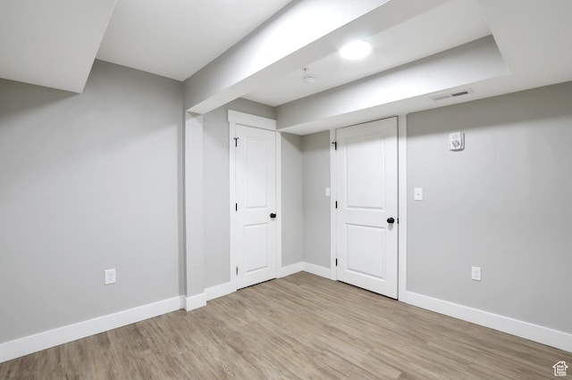 2745 Grant Ave, Ogden, UT 84401 - finished below grade area featuring baseboards, light wood-type flooring, and visible vents