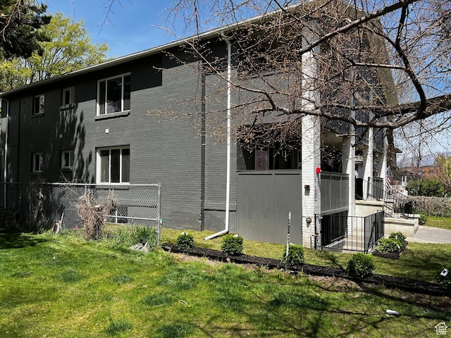 2745 Grant Ave, Ogden, UT 84401 - view of side of home with fence and a yard