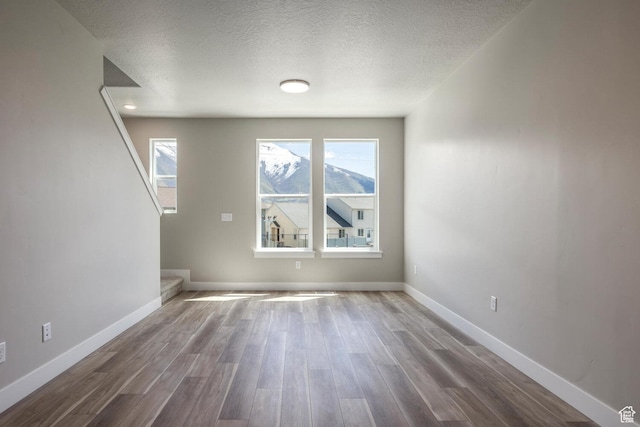 1082 S 2810 E, Spanish Fork, UT 84660 - interior space with a textured ceiling, wood finished floors, and baseboards