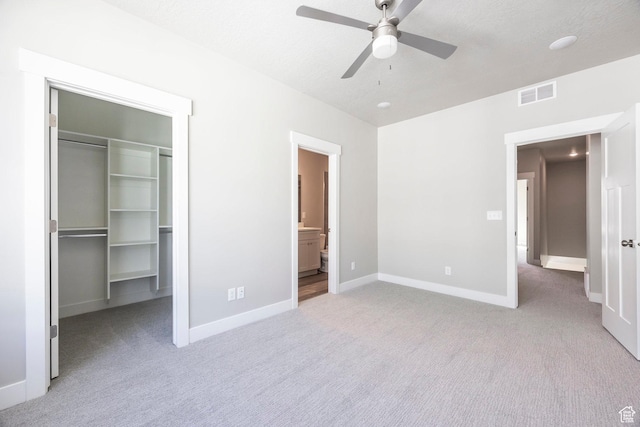 1082 S 2810 E, Spanish Fork, UT 84660 - unfurnished bedroom featuring baseboards, a closet, a spacious closet, light carpet, and visible vents