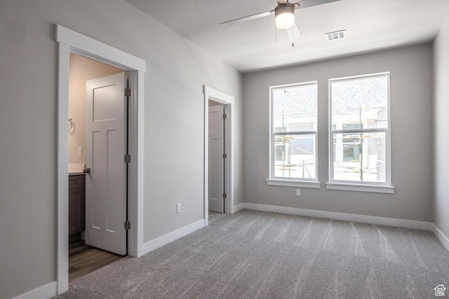 1082 S 2810 E, Spanish Fork, UT 84660 - unfurnished bedroom with ceiling fan, carpet, connected bathroom, visible vents, and baseboards