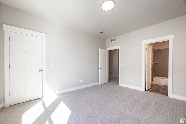 1082 S 2810 E, Spanish Fork, UT 84660 - unfurnished bedroom with ensuite bathroom, baseboards, visible vents, and carpet floors