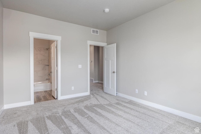 1082 S 2810 E, Spanish Fork, UT 84660 - unfurnished bedroom with visible vents, baseboards, ensuite bathroom, and carpet