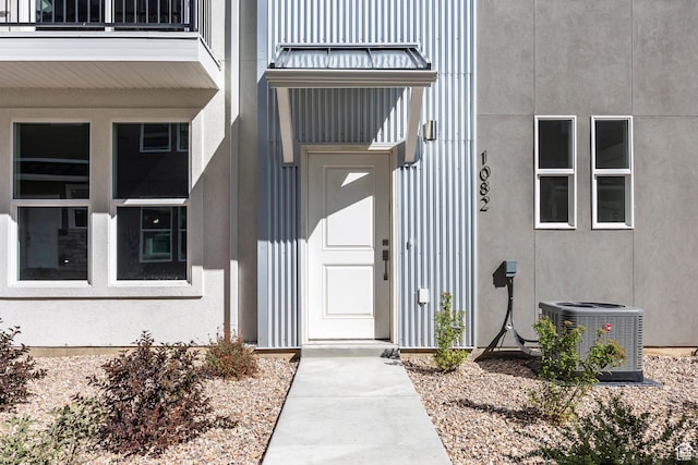 1082 S 2810 E, Spanish Fork, UT 84660 - view of exterior entry featuring a balcony, central AC, and stucco siding