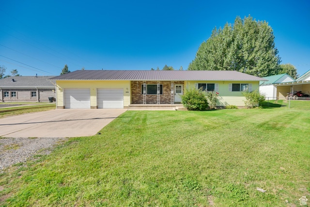 single story home with a garage, brick siding, concrete driveway, and a front yard