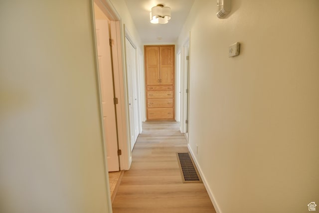 265 E Center St, Beaver, UT 84713 - hallway featuring visible vents, light wood-style flooring, and baseboards