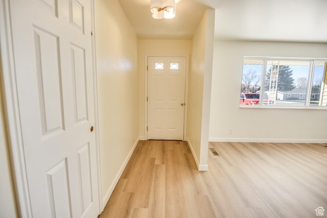 265 E Center St, Beaver, UT 84713 - doorway to outside with a chandelier, visible vents, light wood-style flooring, and baseboards