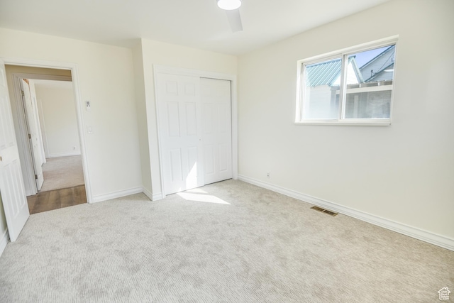 265 E Center St, Beaver, UT 84713 - unfurnished bedroom with baseboards, a closet, visible vents, and carpet flooring