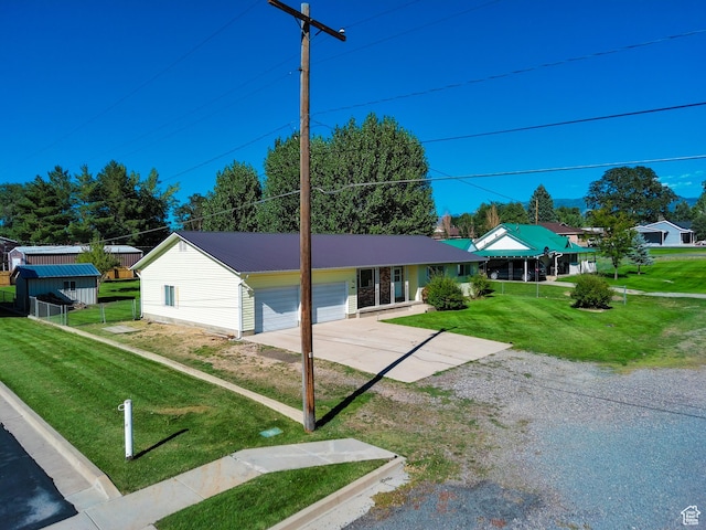 265 E Center St, Beaver, UT 84713 - single story home with metal roof, concrete driveway, a front yard, and a garage