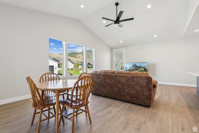 dining area with lofted ceiling, recessed lighting, light wood-type flooring, baseboards, and a ceiling fan