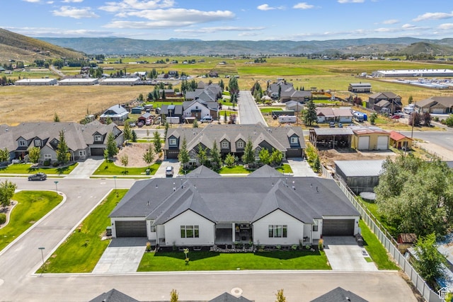 drone / aerial view featuring a mountain view and a residential view