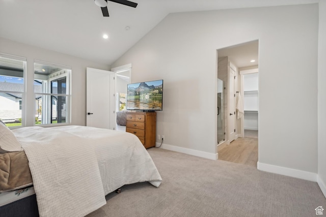 bedroom with baseboards, lofted ceiling, a ceiling fan, and light colored carpet