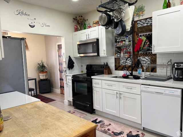 22 W 200 S, Tooele, UT 84074 - kitchen with tasteful backsplash, light countertops, and stainless steel appliances