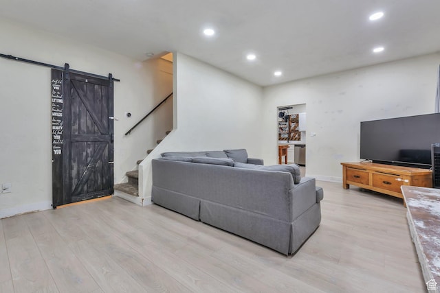 22 W 200 S, Tooele, UT 84074 - living area featuring stairway, light wood-type flooring, a barn door, and recessed lighting