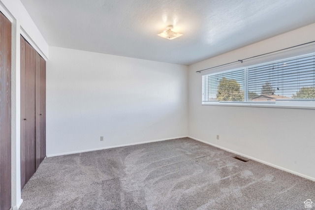 535 N 700 E Unit 1-4, Spanish Fork, UT 84660 - unfurnished bedroom featuring carpet floors, baseboards, and a closet