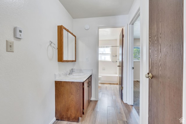535 N 700 E Unit 1-4, Spanish Fork, UT 84660 - full bathroom with vanity, wood finished floors, toilet, baseboards, and shower / bath combination