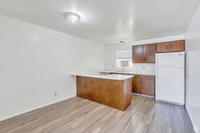 535 N 700 E Unit 1-4, Spanish Fork, UT 84660 - kitchen featuring white fridge, light wood-type flooring, and kitchen peninsula