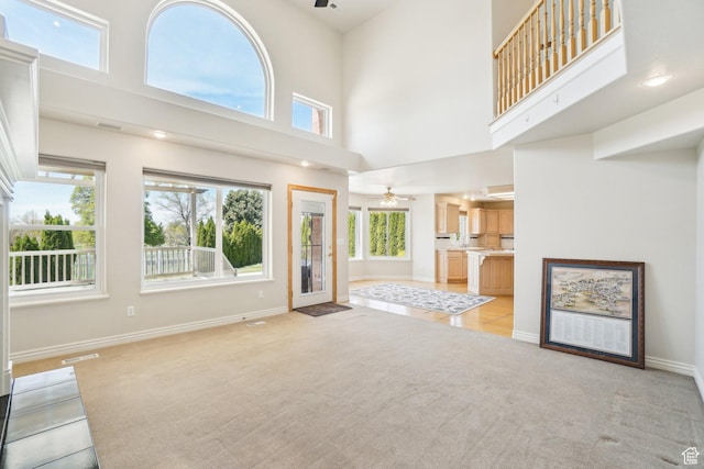678 Eagle Way, Fruit Heights, UT 84037 - unfurnished living room with ceiling fan, baseboards, and light carpet