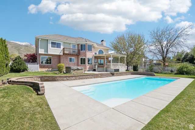 678 Eagle Way, Fruit Heights, UT 84037 - rear view of property with a fenced in pool, a chimney, fence, a balcony, and brick siding