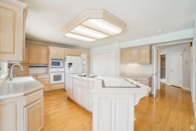 678 Eagle Way, Fruit Heights, UT 84037 - kitchen with light brown cabinets, white appliances, a kitchen island, and a sink