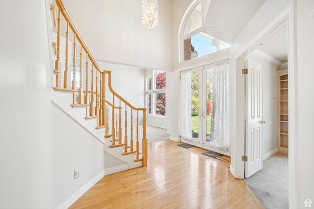 678 Eagle Way, Fruit Heights, UT 84037 - foyer entrance featuring wood-type flooring, baseboards, ornamental molding, and stairs