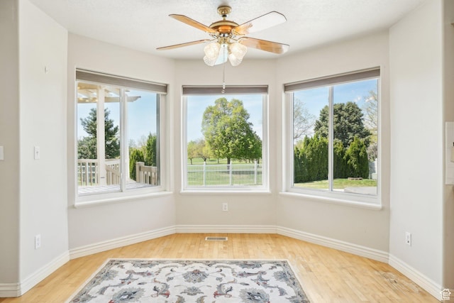 678 Eagle Way, Fruit Heights, UT 84037 - unfurnished room with ceiling fan, baseboards, light wood finished floors, and visible vents