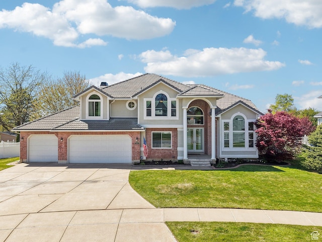 678 Eagle Way, Fruit Heights, UT 84037 - traditional-style house featuring brick siding, driveway, fence, and a front yard