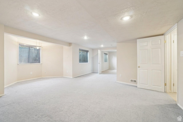 678 Eagle Way, Fruit Heights, UT 84037 - below grade area featuring carpet flooring, a textured ceiling, and visible vents