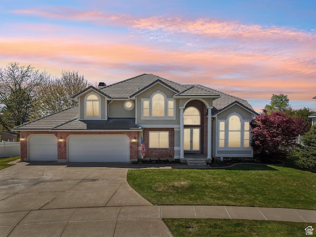 678 Eagle Way, Fruit Heights, UT 84037 - traditional-style home featuring fence, a front lawn, a tile roof, driveway, and brick siding