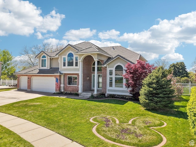 678 Eagle Way, Fruit Heights, UT 84037 - traditional home with fence, a front lawn, stucco siding, and concrete driveway