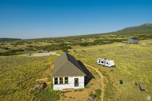bird's eye view featuring a rural view and a mountain view
