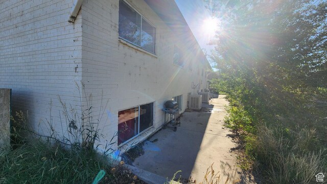 370 W 620 N, Castle Dale, UT 84513 - view of side of property with central AC unit and brick siding