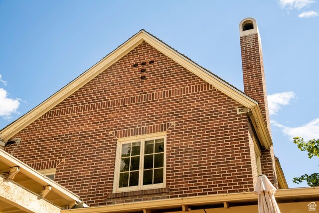 2633 E 6200 S, Holladay, UT 84121 - view of property exterior featuring a chimney and brick siding