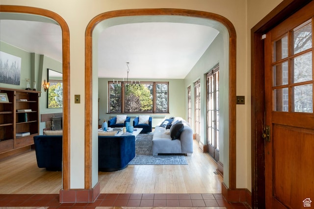 2633 E 6200 S, Holladay, UT 84121 - living area featuring wood finished floors, arched walkways, and baseboards