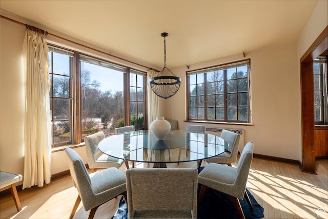 2633 E 6200 S, Holladay, UT 84121 - dining space featuring light wood-type flooring, a chandelier, and baseboards