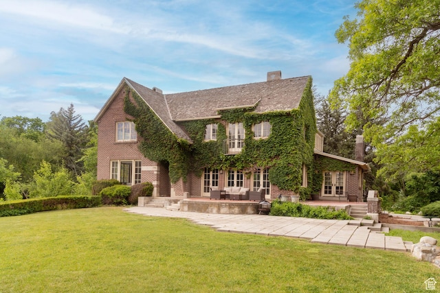 2633 E 6200 S, Holladay, UT 84121 - tudor house with french doors, a patio area, and a front yard