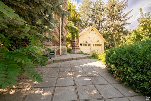 2633 E 6200 S, Holladay, UT 84121 - view of patio with an outbuilding and a detached garage