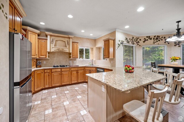kitchen featuring custom range hood, stainless steel appliances, decorative backsplash, light stone counters, and a peninsula